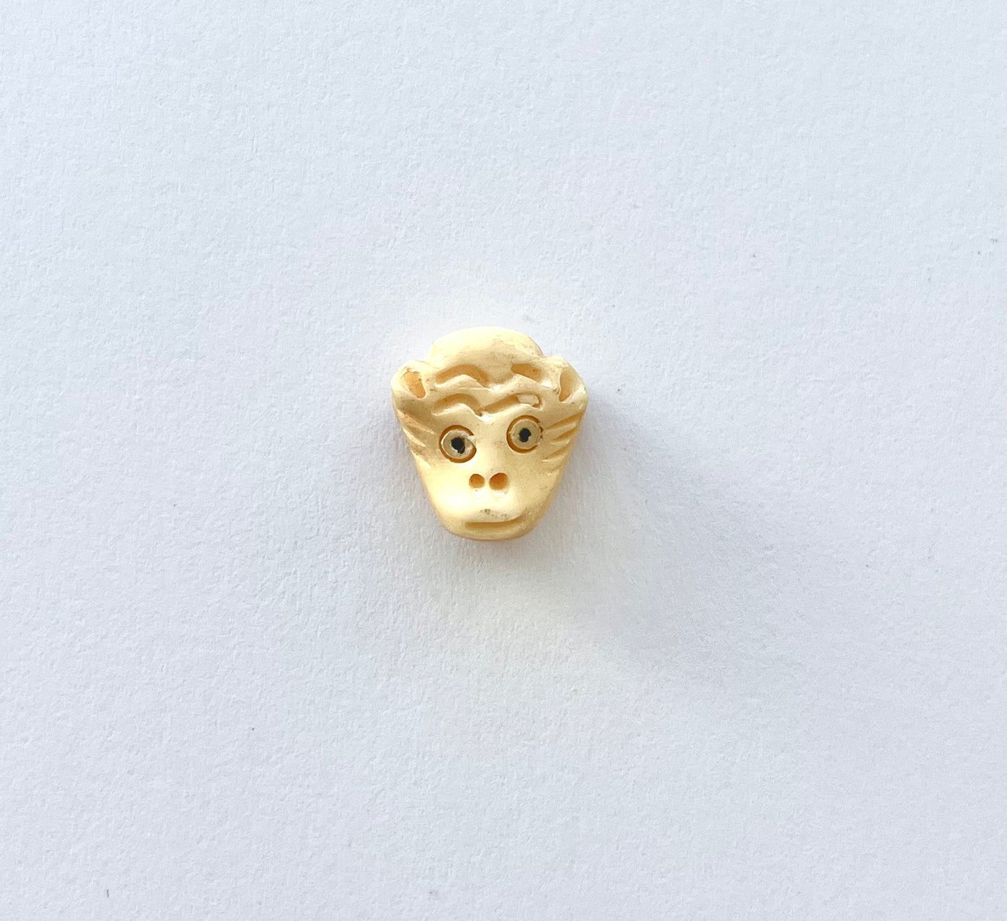 Colgante cabeza de mono 1,3x1,2x0,6 cm (par)