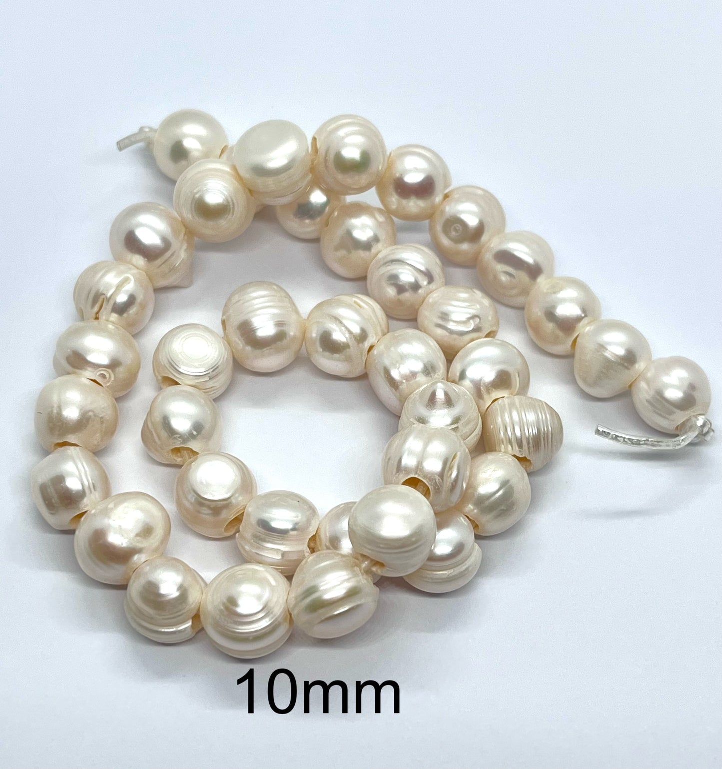 Perlas 10mm aprox. (Irregular)Hueco 3mm (12 unidades)