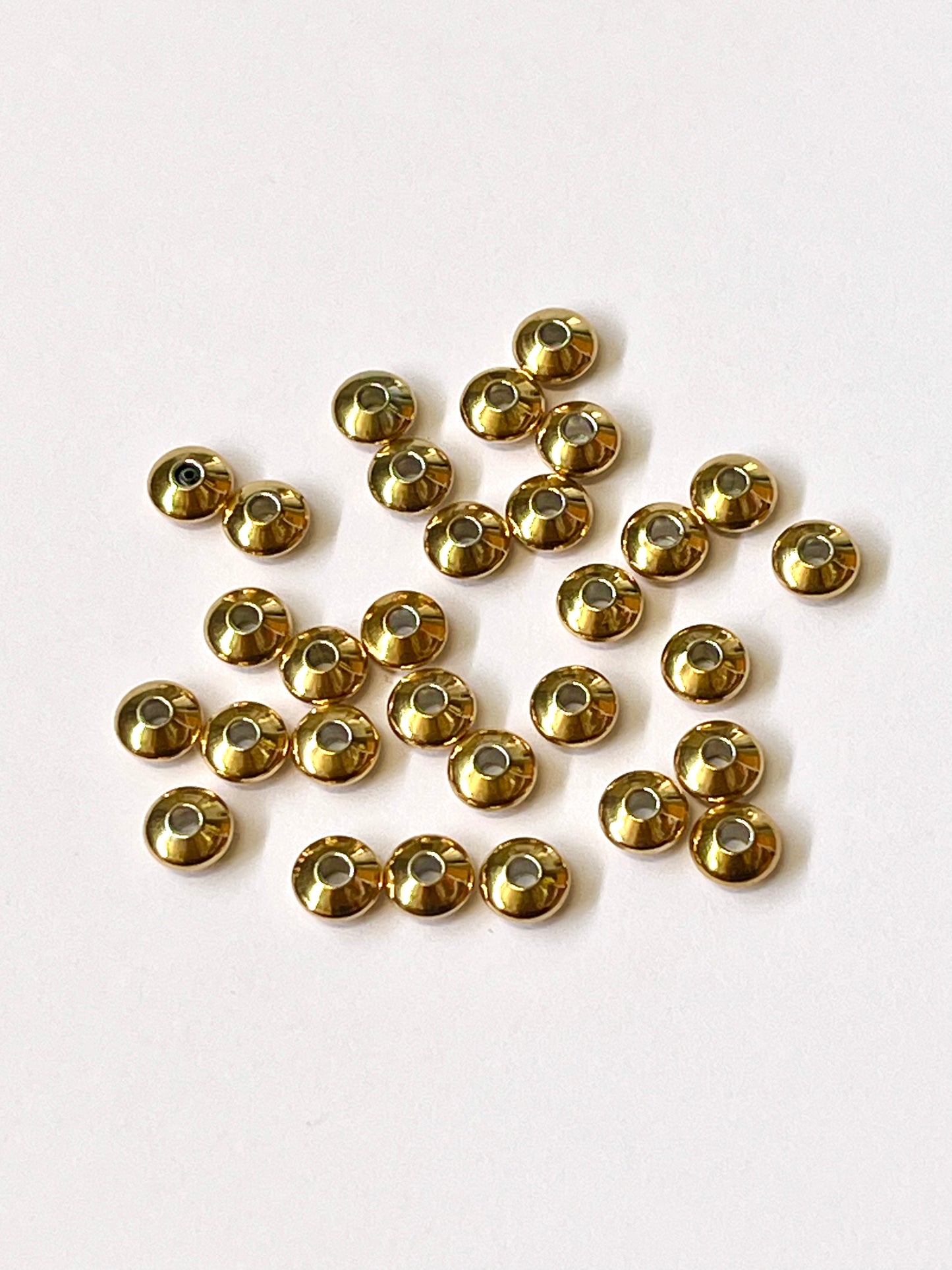 Bolitas/balin chato 6x3mm hueco2mm