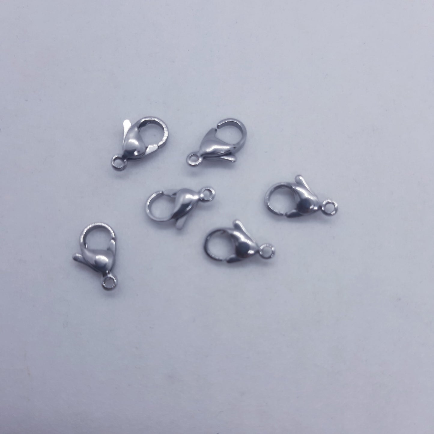 Cierre/Broche acero inoxidable plateado 13x8mm