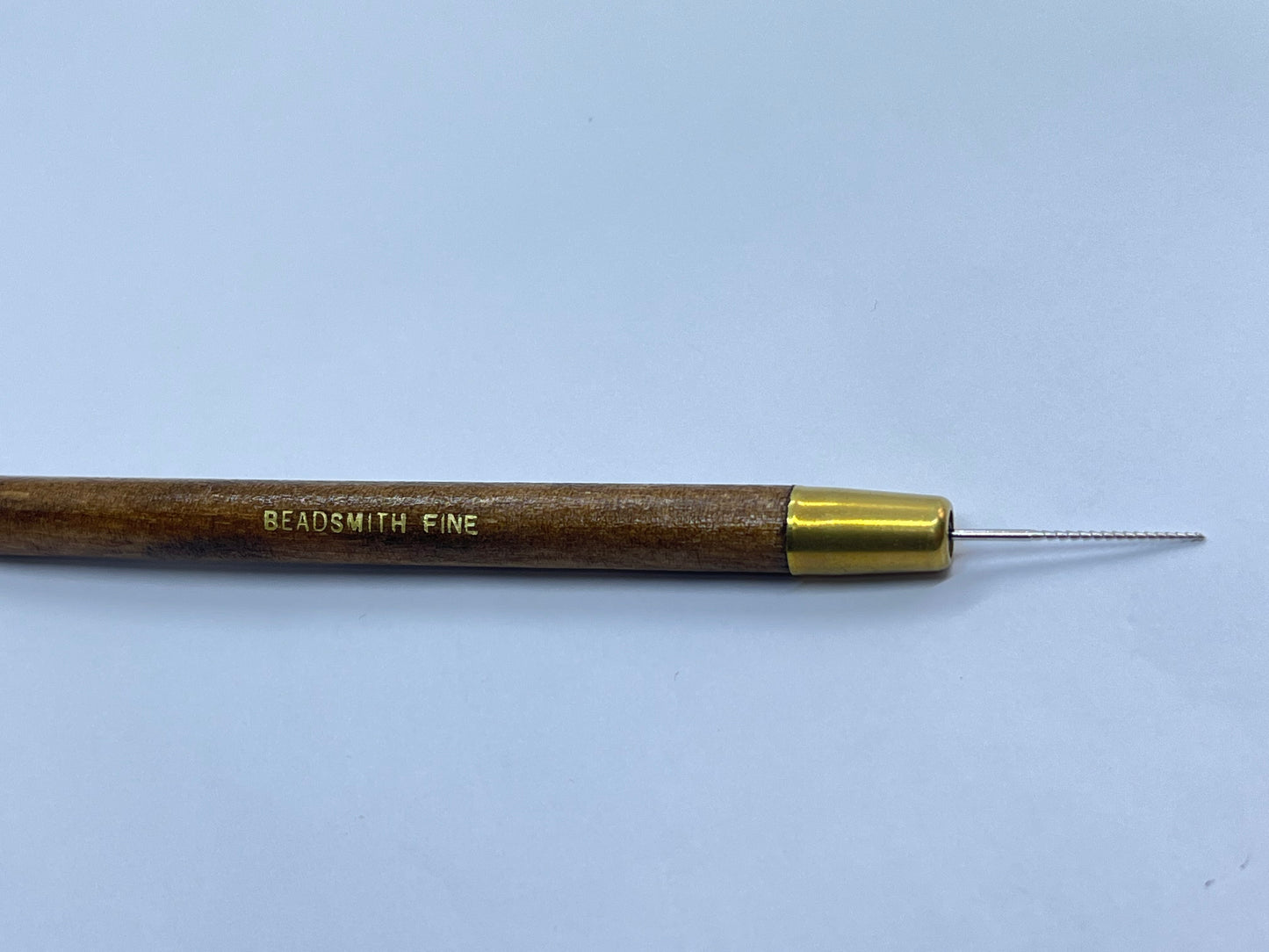 Escareador (abridor) de perlas